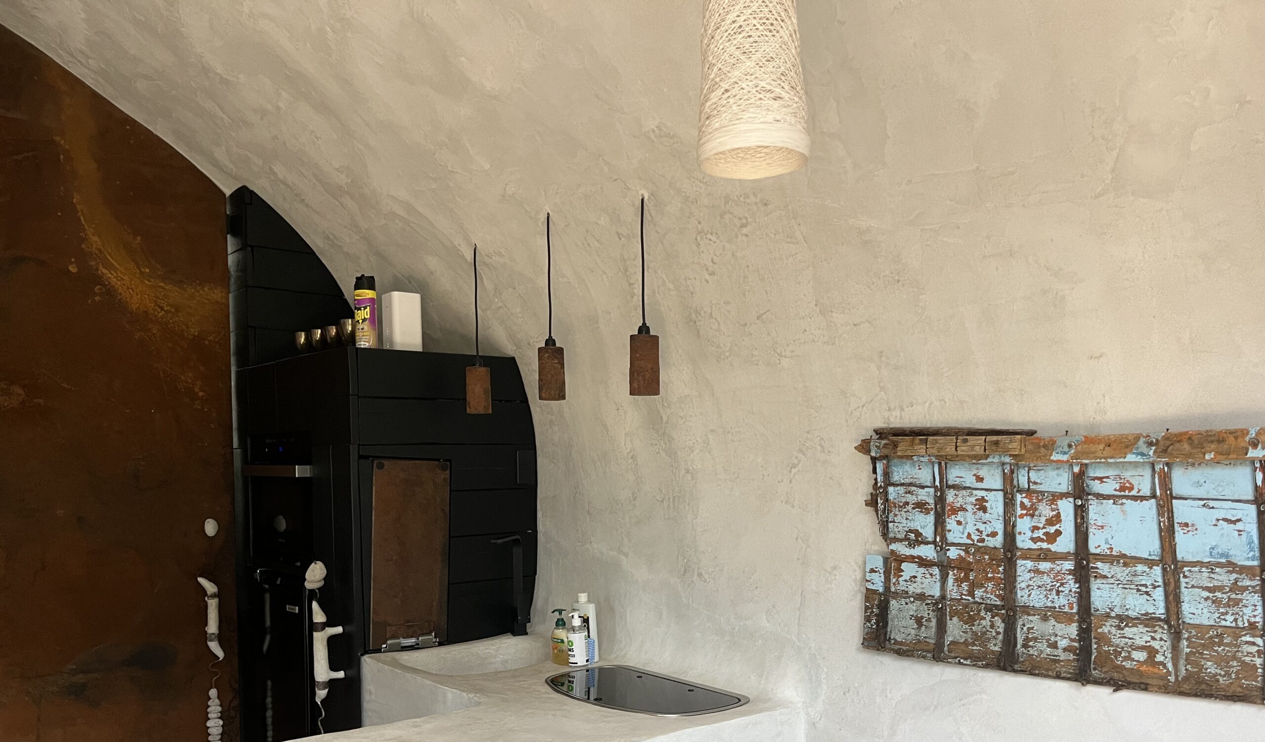 Interior of Pumice AirBnB with stone-styled walls
